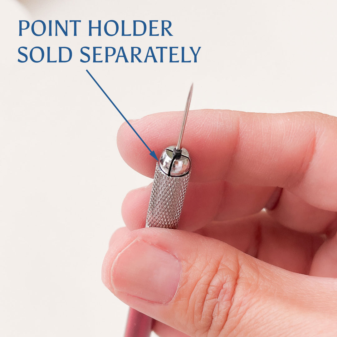 Hand holding a small metal tool with text indicating it is sold separately on a light background