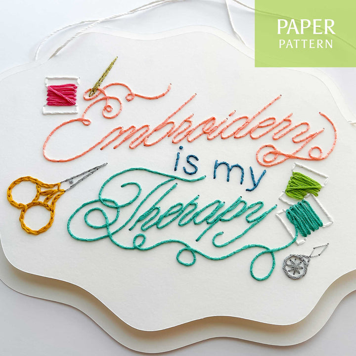 Embroidery pattern with 'Embroidery is my Therapy' text and embroidery tools on a white background.