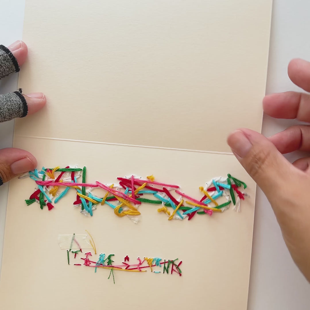 Folding a card to reveal the greeting &
